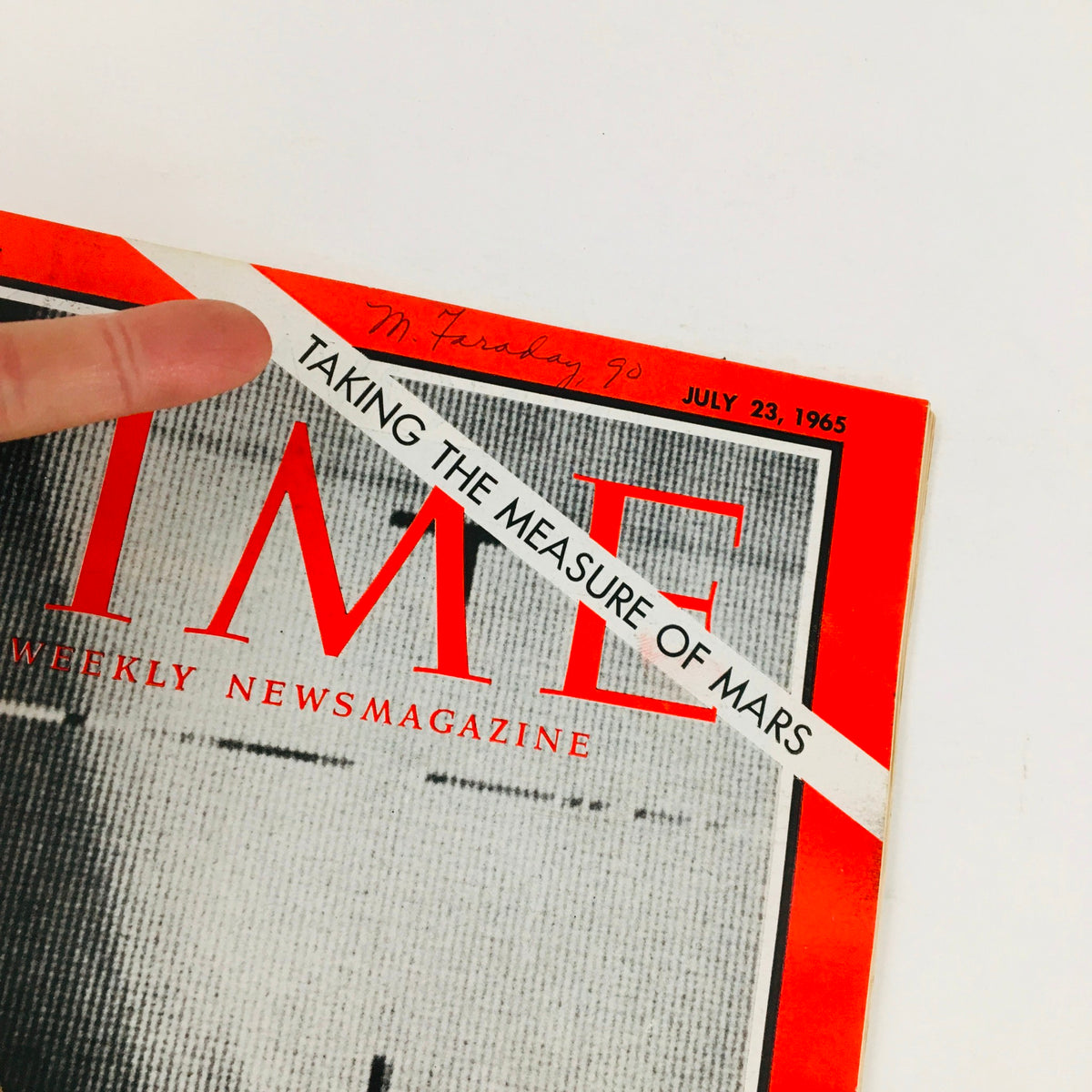 Close-up of the Time Magazine cover dated July 23, 1965, highlighting the title 'Taking the Measure of Mars' alongside Mariner's William Pickering's feature, including a handwritten note.
