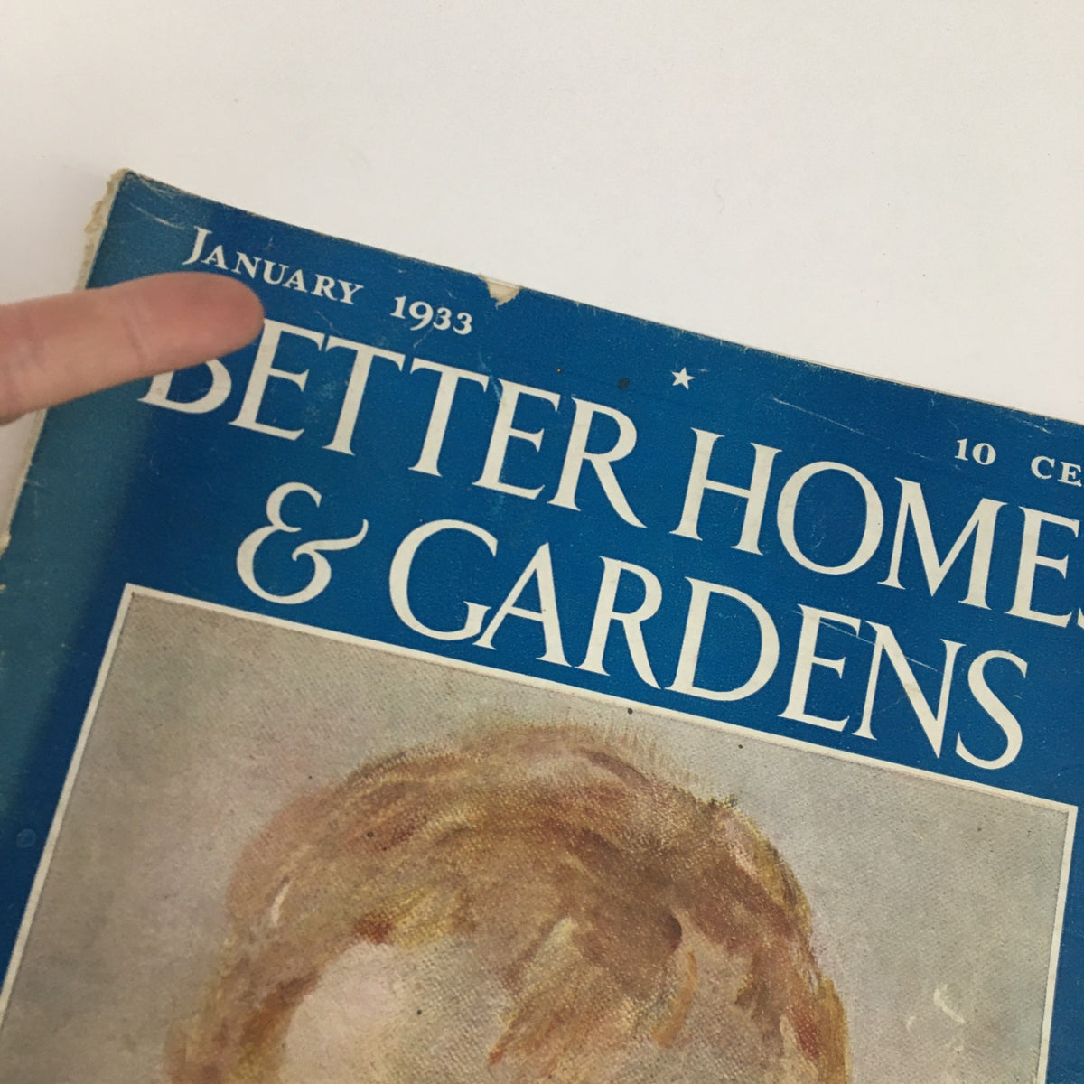 Close-up of the Better Homes & Gardens January 1933 magazine cover, focusing on the title and the vintage illustration of a child.