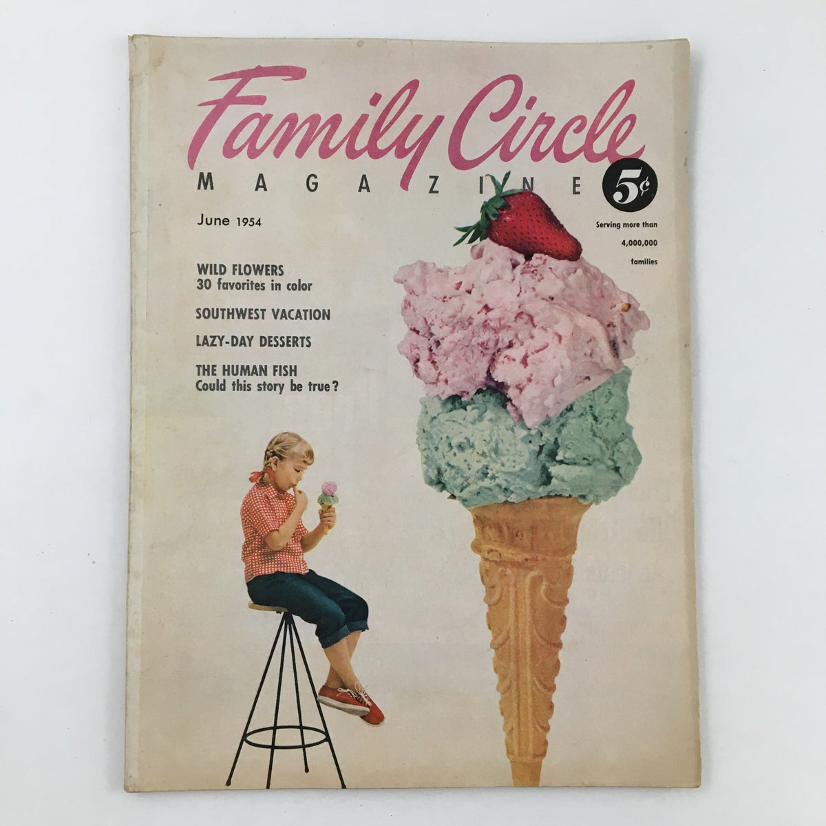 Cover of Family Circle Magazine from June 1954 featuring a young girl enjoying ice cream, highlighting the issue's theme 'The Human Fish' and articles on Wild Flowers and Lazy-Day Desserts.