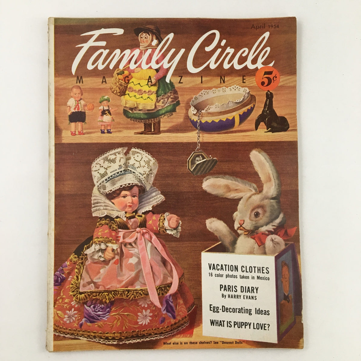 Cover of Family Circle Magazine April 1954 featuring Easter Bunny and colorful dolls, showcasing Easter-time ideas and vintage holiday decor.