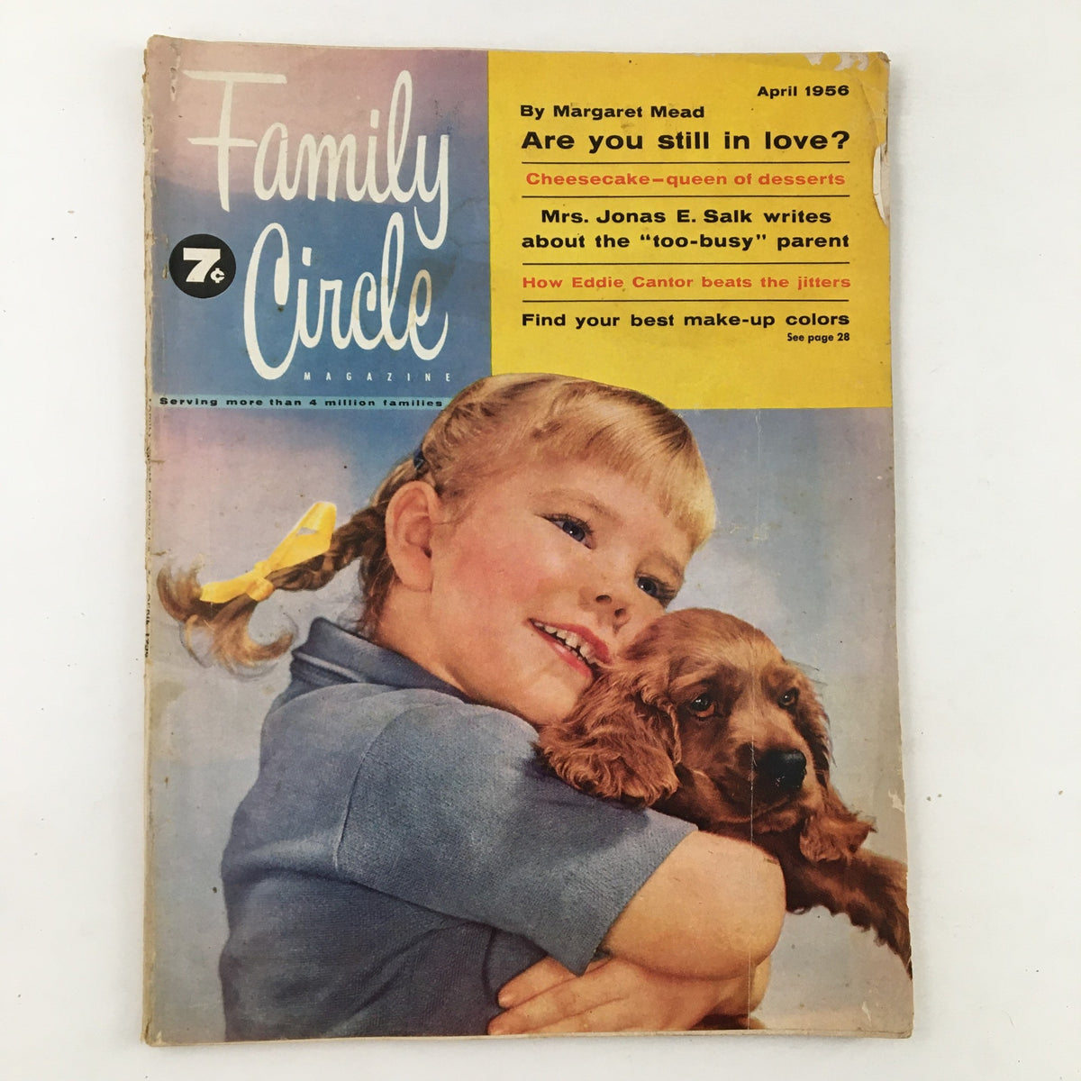 Family Circle Magazine April 1956 cover featuring a girl with braids hugging a puppy, showcasing the title and various articles including 'How Eddie Cantor Beats The Jitters'.