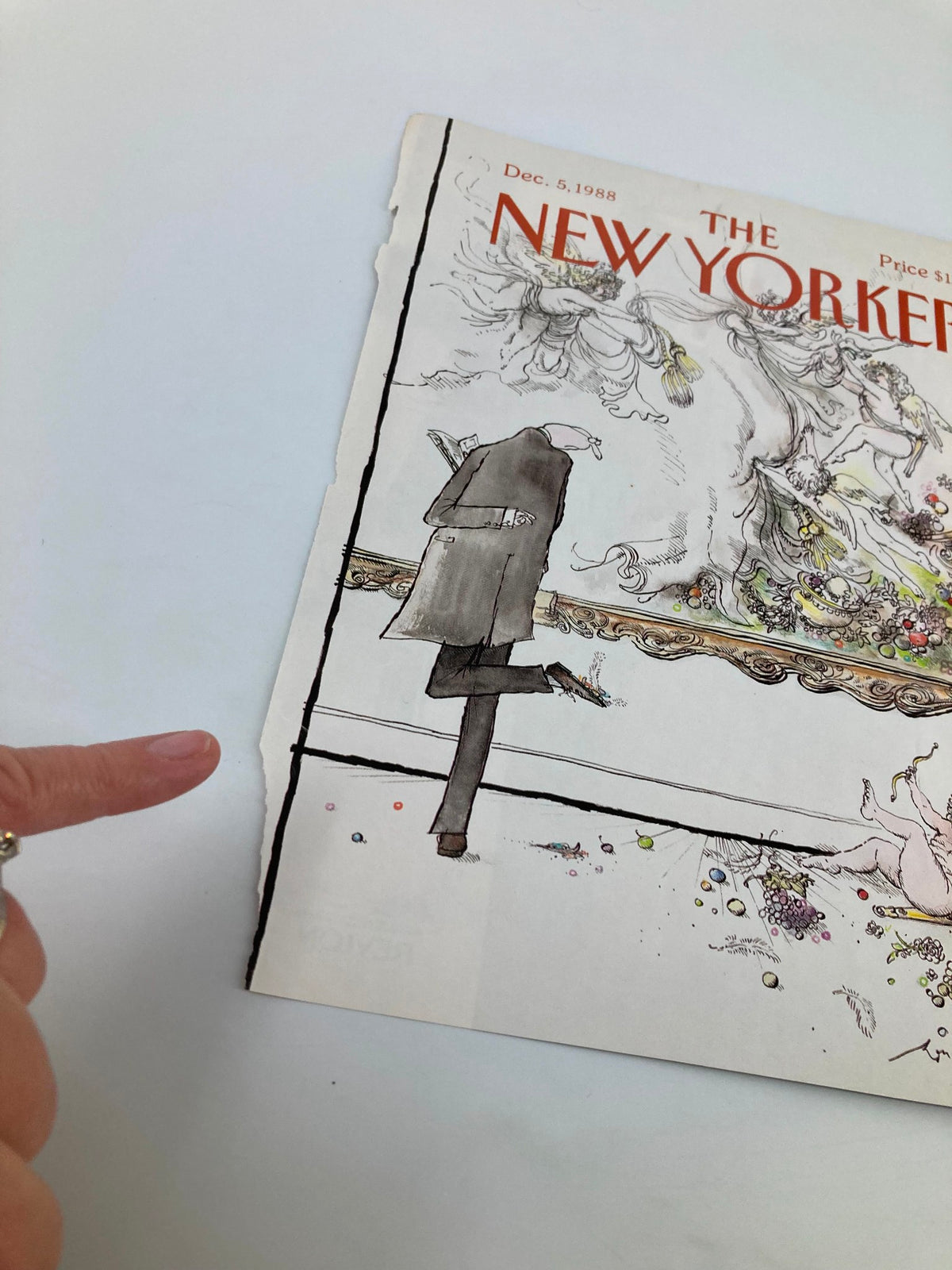 Close-up of The New Yorker cover December 5 1988 'Angel's a Mess' by Ronald Searle, highlighting details of the illustration and frayed edges.