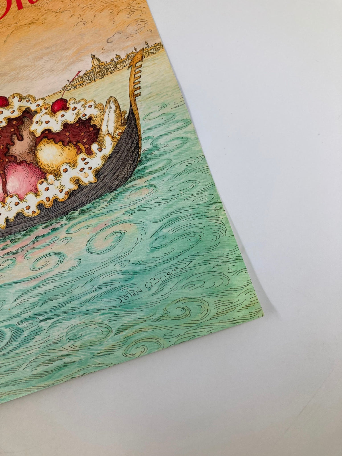 Close-up view of The New Yorker July 16, 1990 cover, highlighting the Sundae Boat and John O'Brien's signature, with colorful water swirls and details of the illustration.