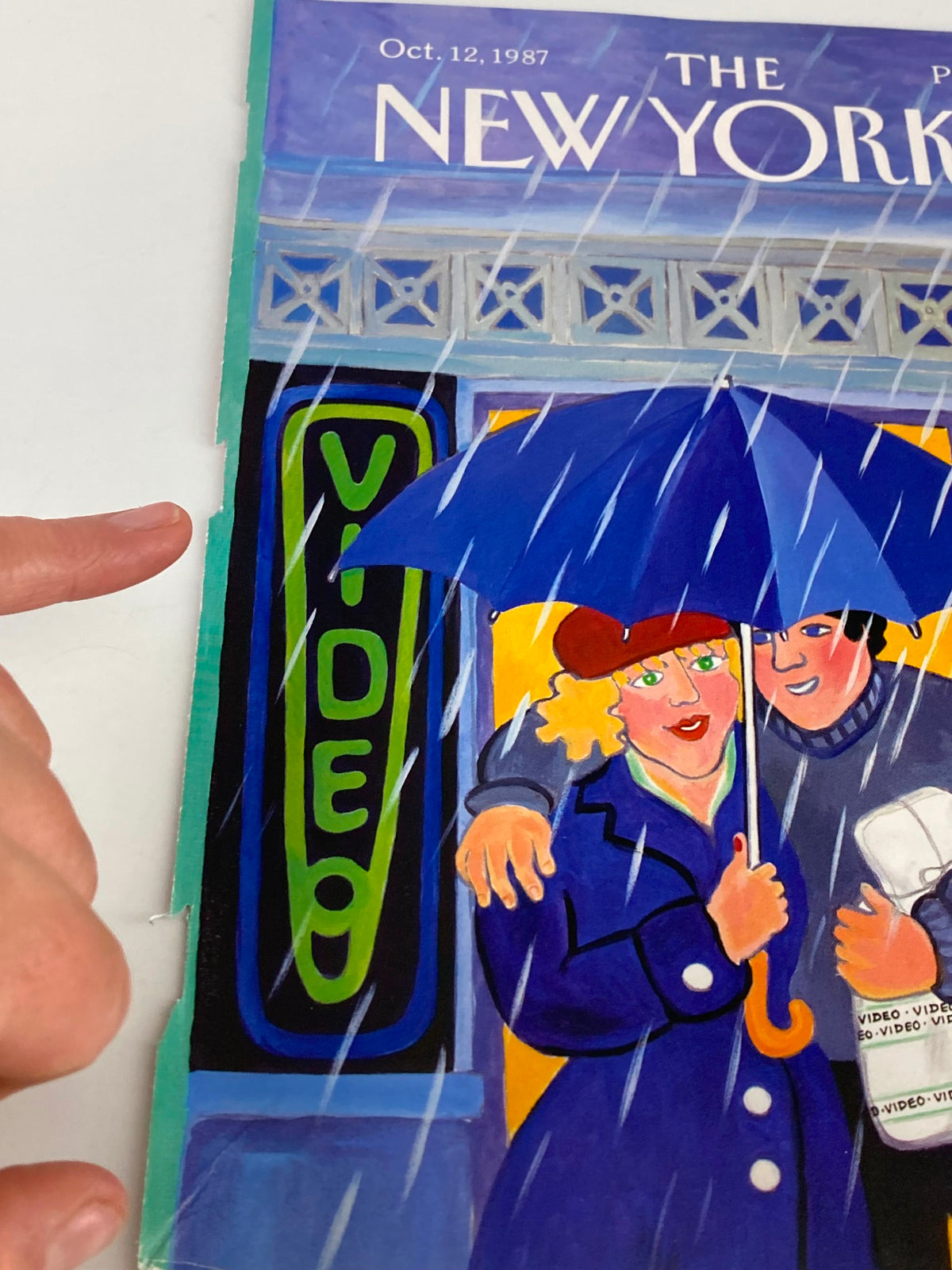 COVER ONLY of The New Yorker October 12, 1987, close-up view of a couple under an umbrella by Barbara Westman highlighting the magazine's vintage style.