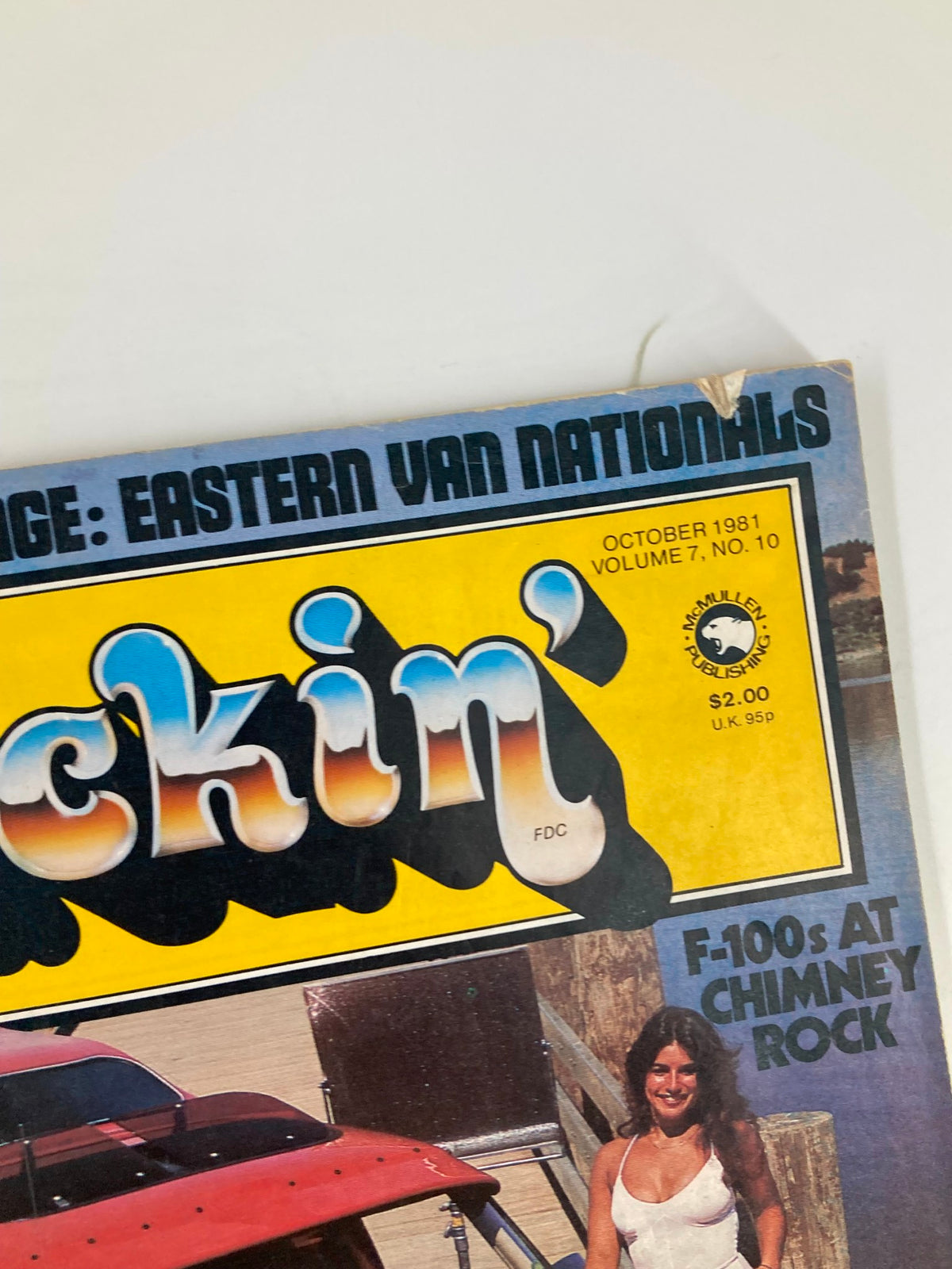 Detail of VTG Truckin Magazine October 1981 cover showcasing the magazine title and a model standing next to a modified vehicle with artistic designs.