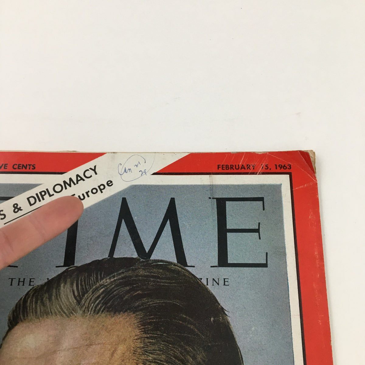 Close-up of Time Magazine February 15, 1963, Volume 81, No. 7, focusing on the title 'Weapons & Diplomacy' and the publication date, showing minor wear.