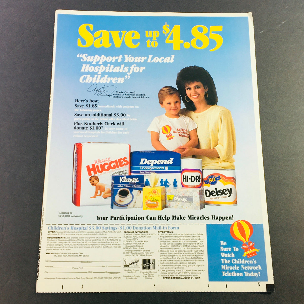 VTG Retro 1987 Kimberly Clark Diaper Products Marie Osmond Donation Ad Coupon featuring a promotional advertisement that highlights savings on Huggies, Depend, and other Kimberly-Clark products, encouraging support for local hospitals.