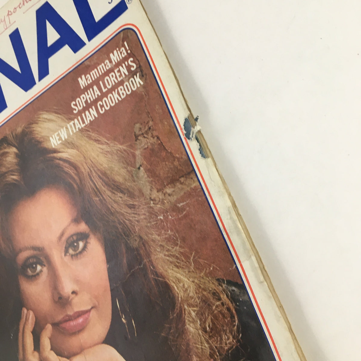 Side view of Ladies' Home Journal Magazine March 1972 presenting Sophia Loren's New Italian Cookbook, displaying cover wear and minor damages.