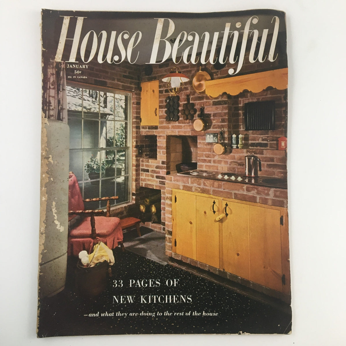 Cover of House Beautiful Magazine, January 1952 featuring a vintage kitchen design showcasing the pass-through counter, with a focus on mid-century aesthetics.