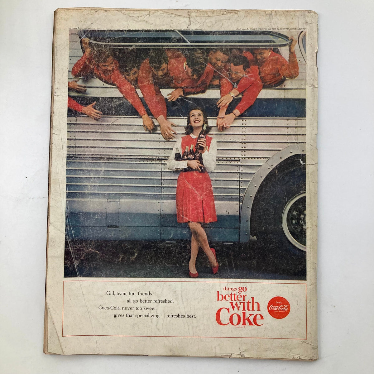 Cover of VTG Life Magazine November 22, 1963, featuring a Coca-Cola advertisement with a woman in a red dress surrounded by cheerful individuals in red apparel, promoting the slogan 'Things go better with Coke.'