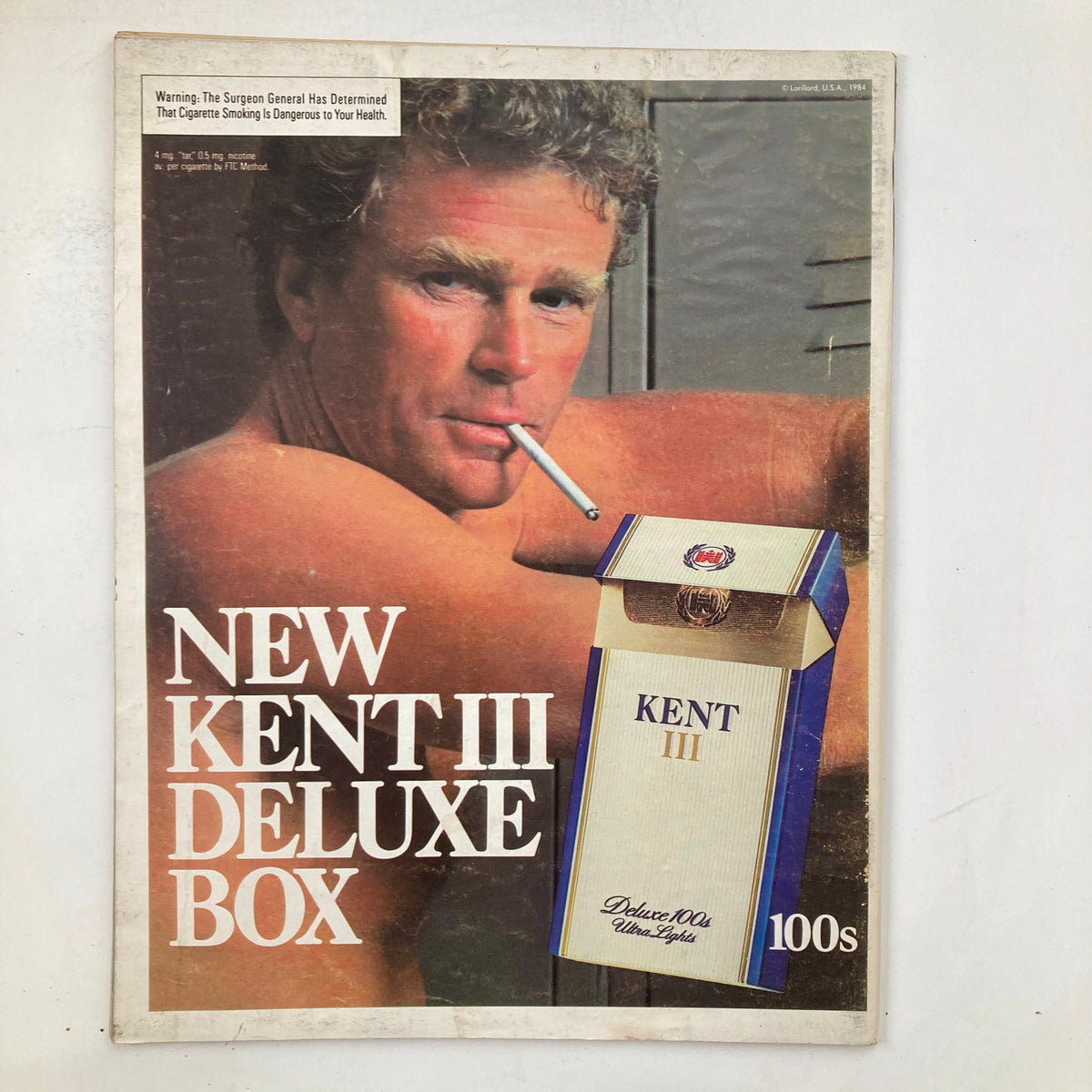 Vintage advertisement from the VTG Life Magazine February 1985 featuring a promotional image for New Kent III Cigarettes showcasing a man with a cigarette.