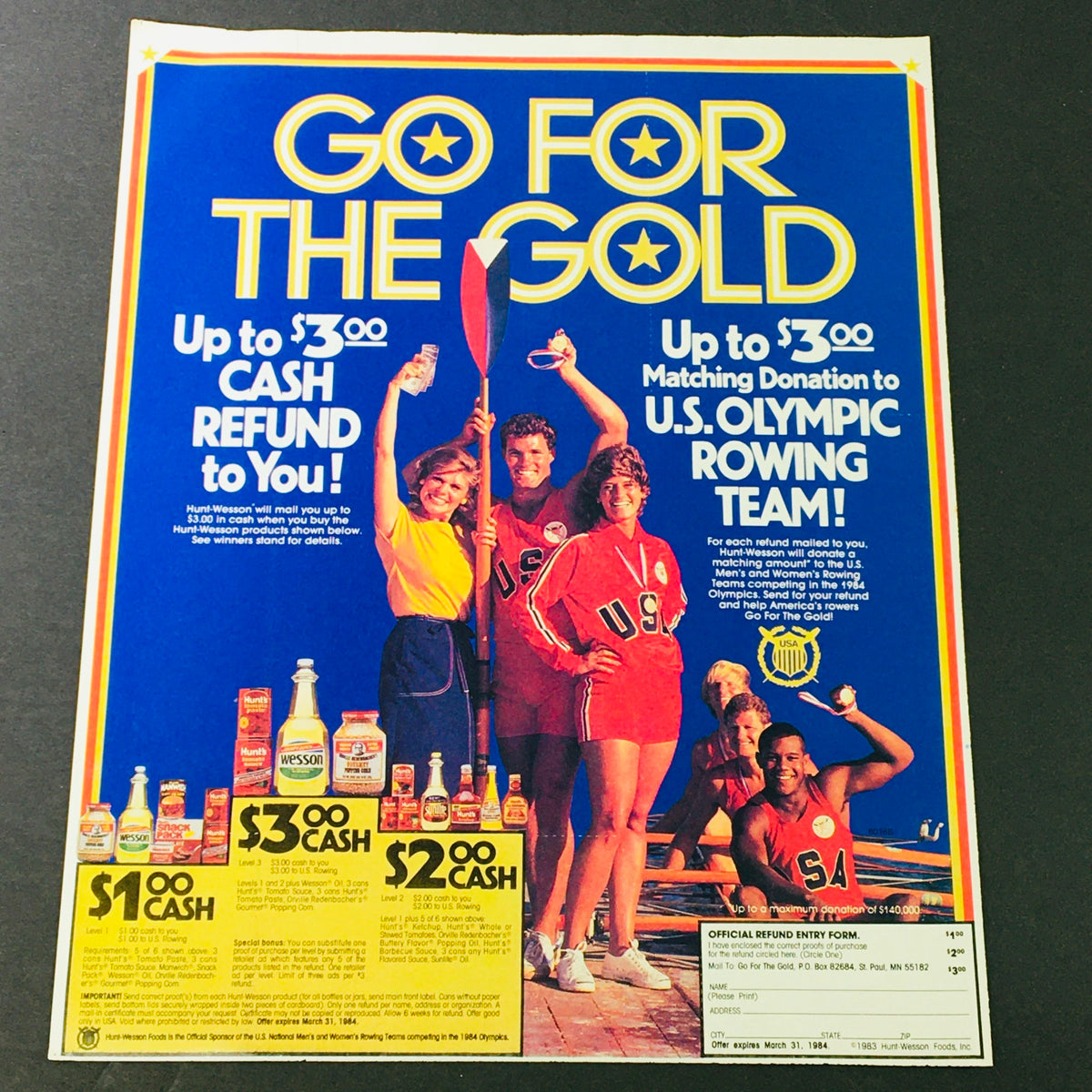 VTG Retro 1984 Hunt-Wesson Foods U.S. Olympic Rowing Team Sponsor Ad Coupon featuring a colorful advertisement with athletes in jerseys promoting cash refunds and a matching donation to the U.S. Olympic Rowing Team.
