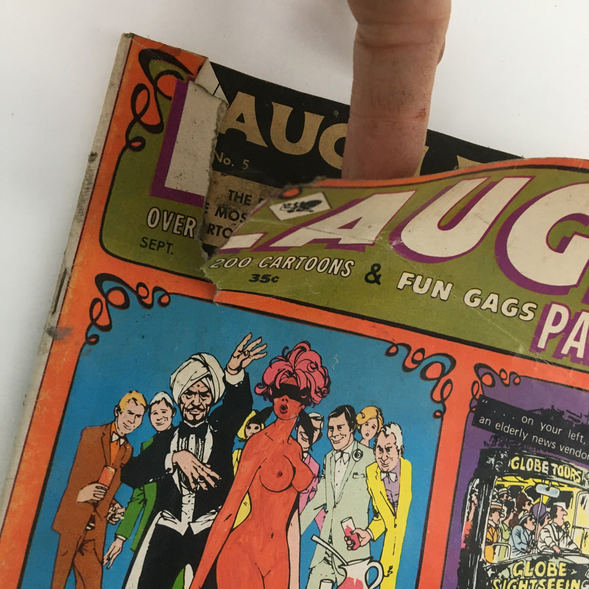 Close-up of Laugh Parade Magazine - September 1969 cover highlighting The Hippie Cinderella Special, showing cartoon-style characters and vibrant colors typical of the era.