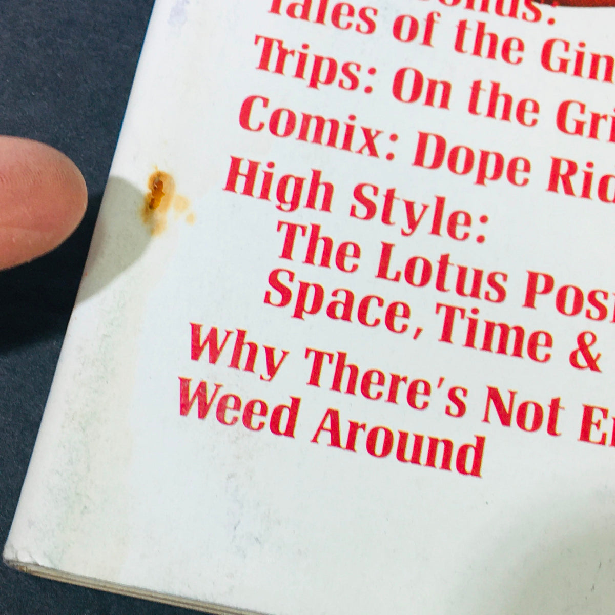 Close-up of the VTG High Times Magazine December January 1975 #7 detailing various article titles, reflecting the vintage publication's focus on cannabis culture and drug enforcement themes.