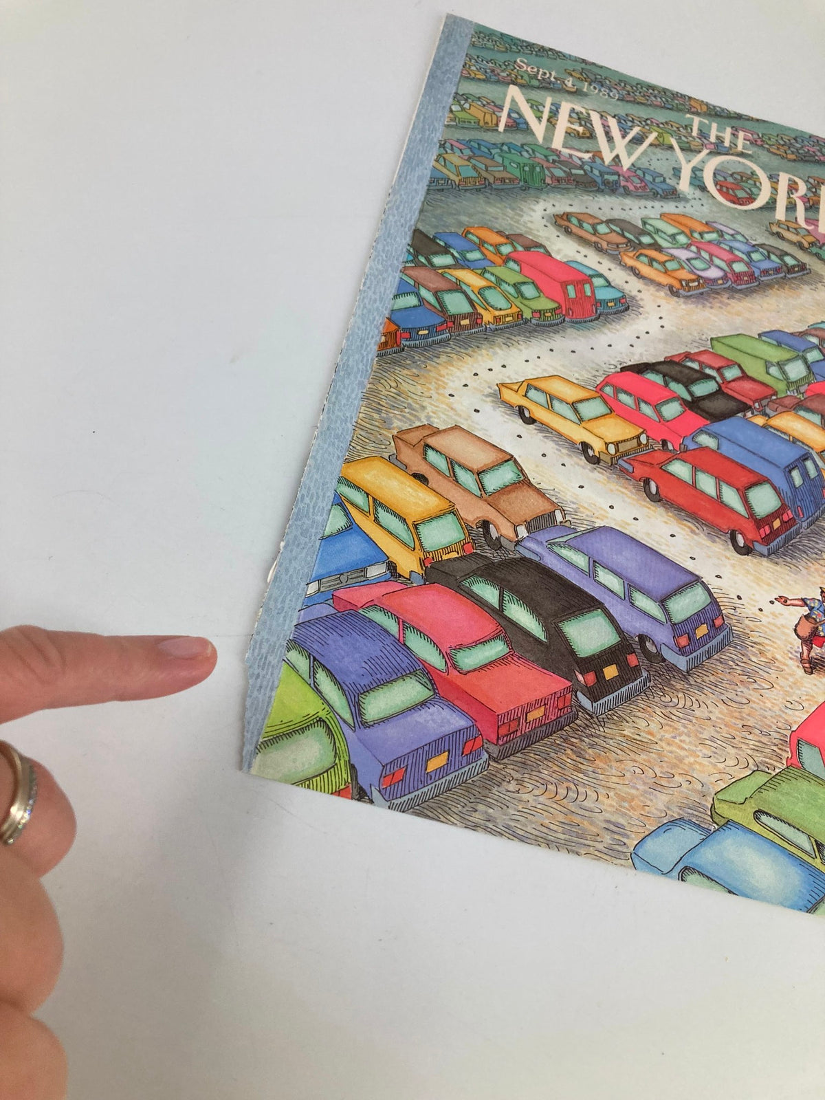 Close-up of The New Yorker cover, September 4, 1989, titled 'Parking Spot' by John O'Brien, highlighting slight wear at the edge of the magazine.