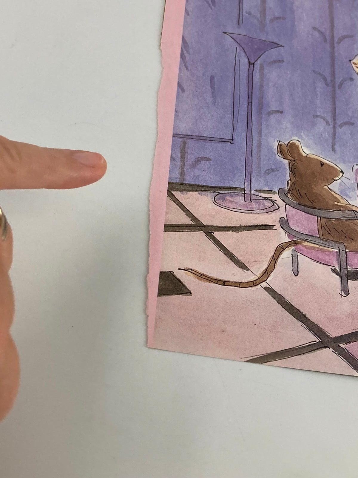 Side view of The New Yorker cover from April 24, 1989, featuring a creative illustration titled 'Mouse and People' with an emphasis on the torn edge and a finger pointing at the art.