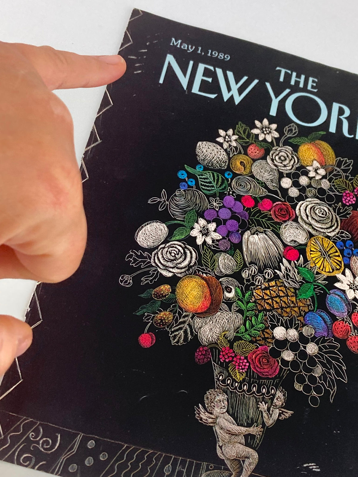 Detailed view of The New Yorker cover, dated May 1, 1989, highlighting the artistic depiction of a fruit and flower vase by Pamela Paparone.