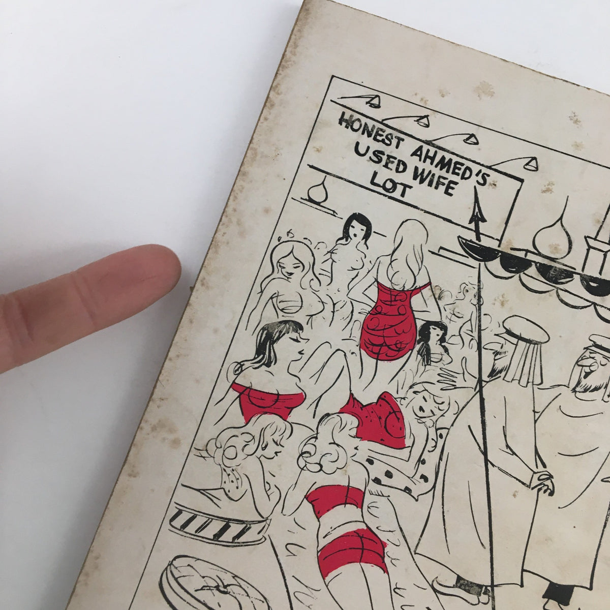 Detailed image of the back cover of Dolls & Gags Magazine October 1958, illustrating a playful cartoon with humorous depictions.