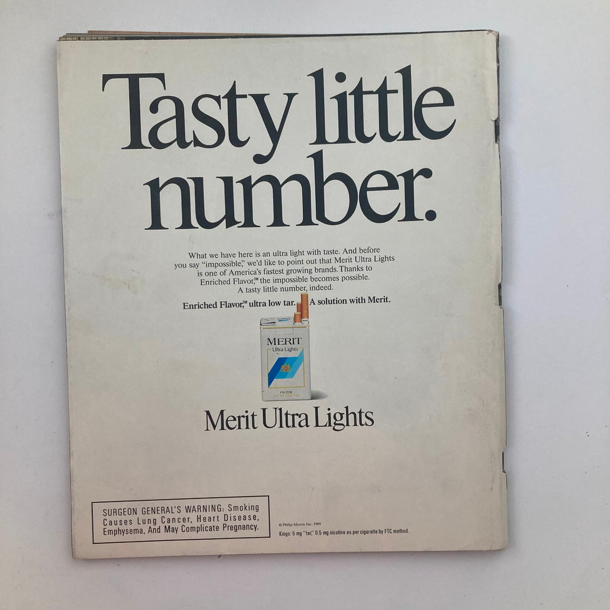 Back cover of VTG Life Magazine Fall 1989 Vol 12 No. 12 advertising 'Merit Ultra Lights' cigarettes, featuring the slogan 'Tasty little number' with a warning about smoking.