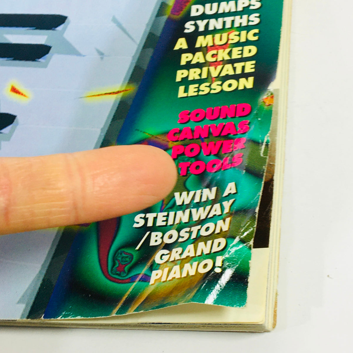Close-up of Keyboard Magazine February 1994 cover highlighting 'Sound Canvas Power Tools' with finger pointing to text, emphasizing the magazine's focus on music technology.