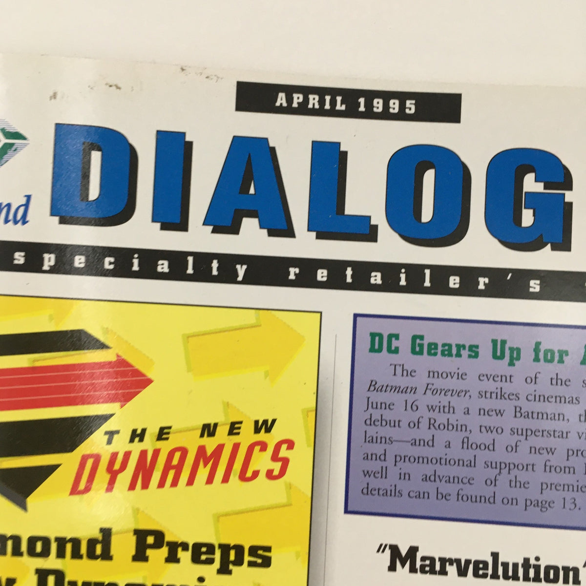 Close-up of the Diamond Dialogue Comics cover from April 1995 illustrating the magazine's title and sections on comic book industry dynamics.