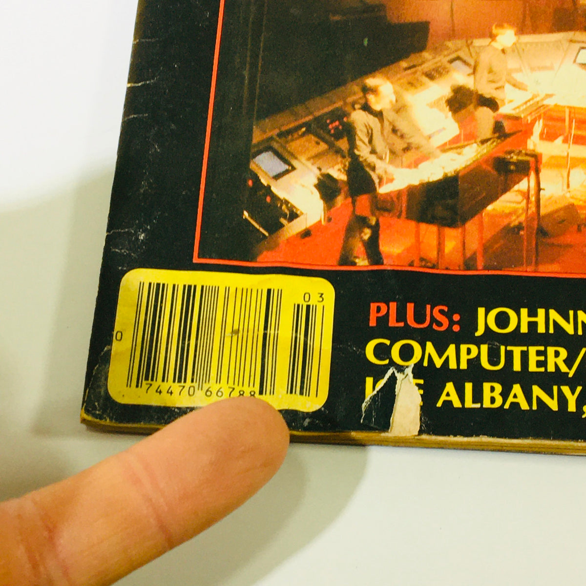 Close-up of the back cover of the VTG Keyboard Magazine March 1982 featuring a barcode and details on articles about Kraftwerk, Johnny Kemm, and Kevin Toney.