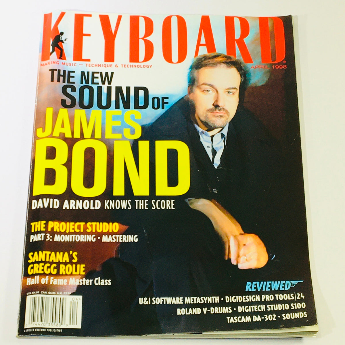 Keyboard Magazine April 1998 cover featuring David Arnold discussing the new sound of James Bond, along with highlights on Santana's Gregg Rolie masterclass and music production insights.