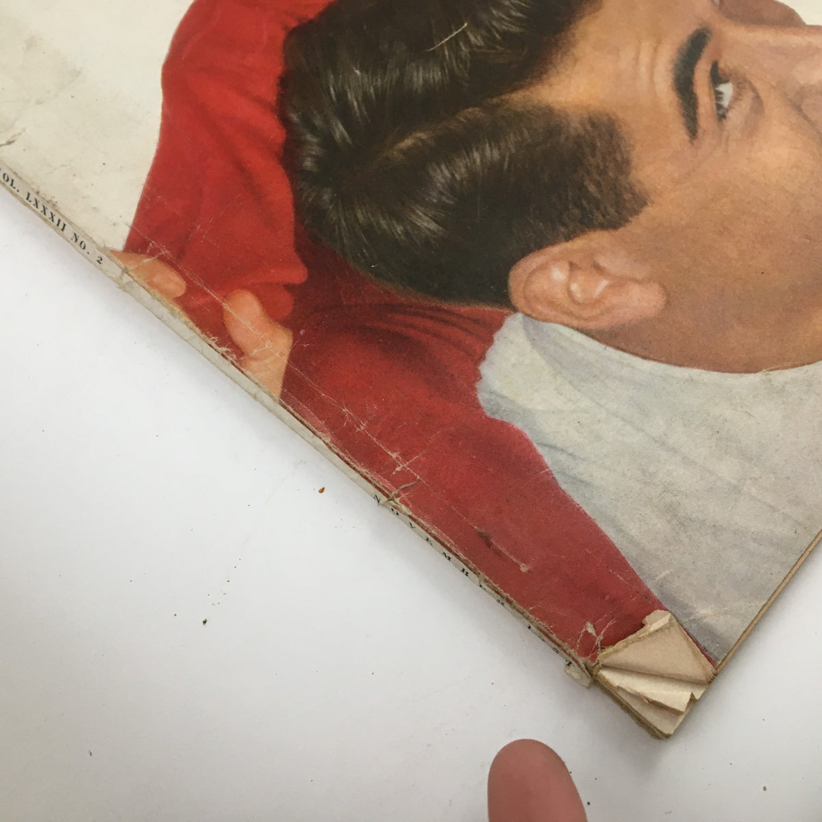 Close-up of the corner of McCall's Magazine November 1954 cover, showing vintage design elements and slight wear, reflecting its collectible nature.