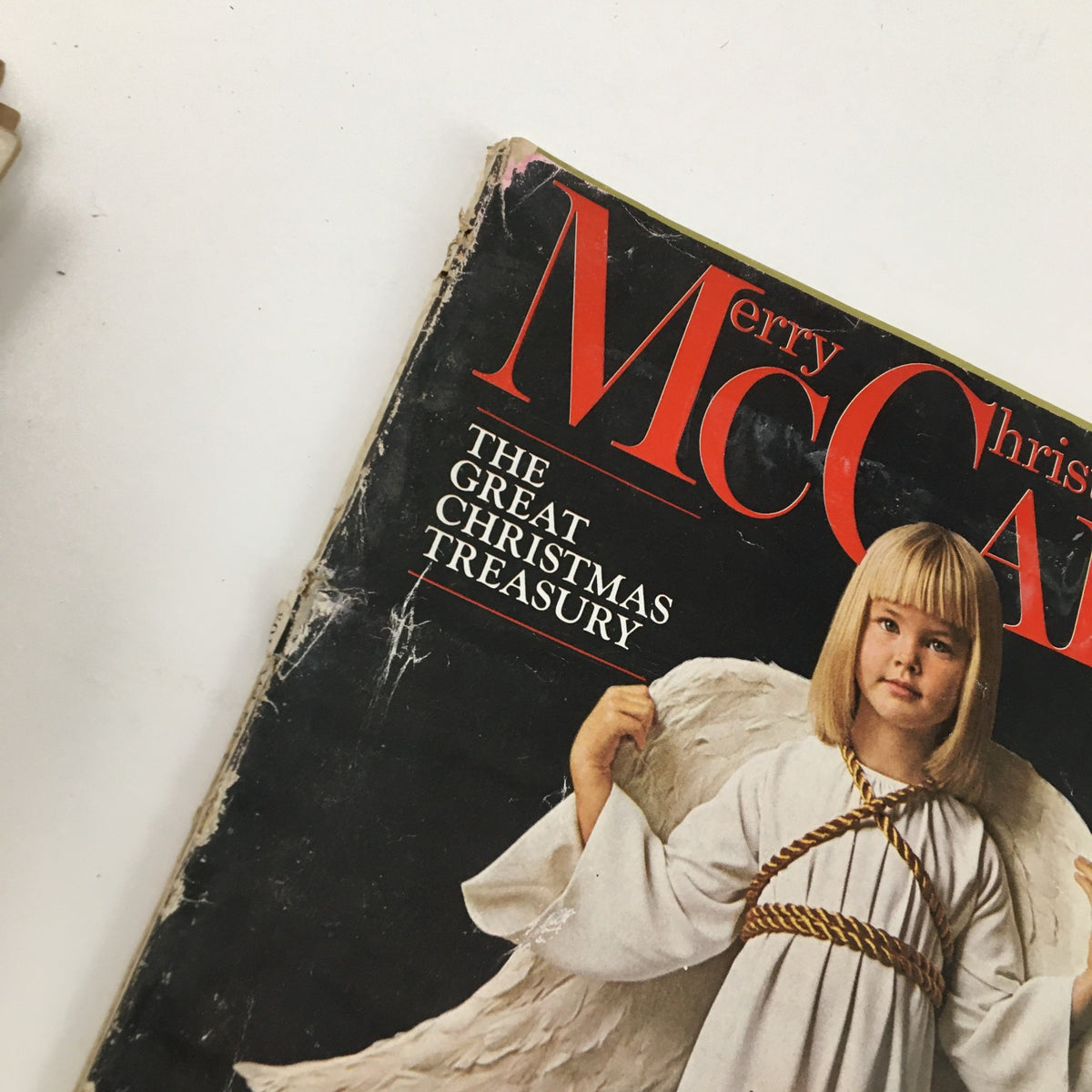 Close-up of the cover of McCall's Magazine December 1963, highlighting the child in angel costume and the title 'The Great Christmas Treasury'.
