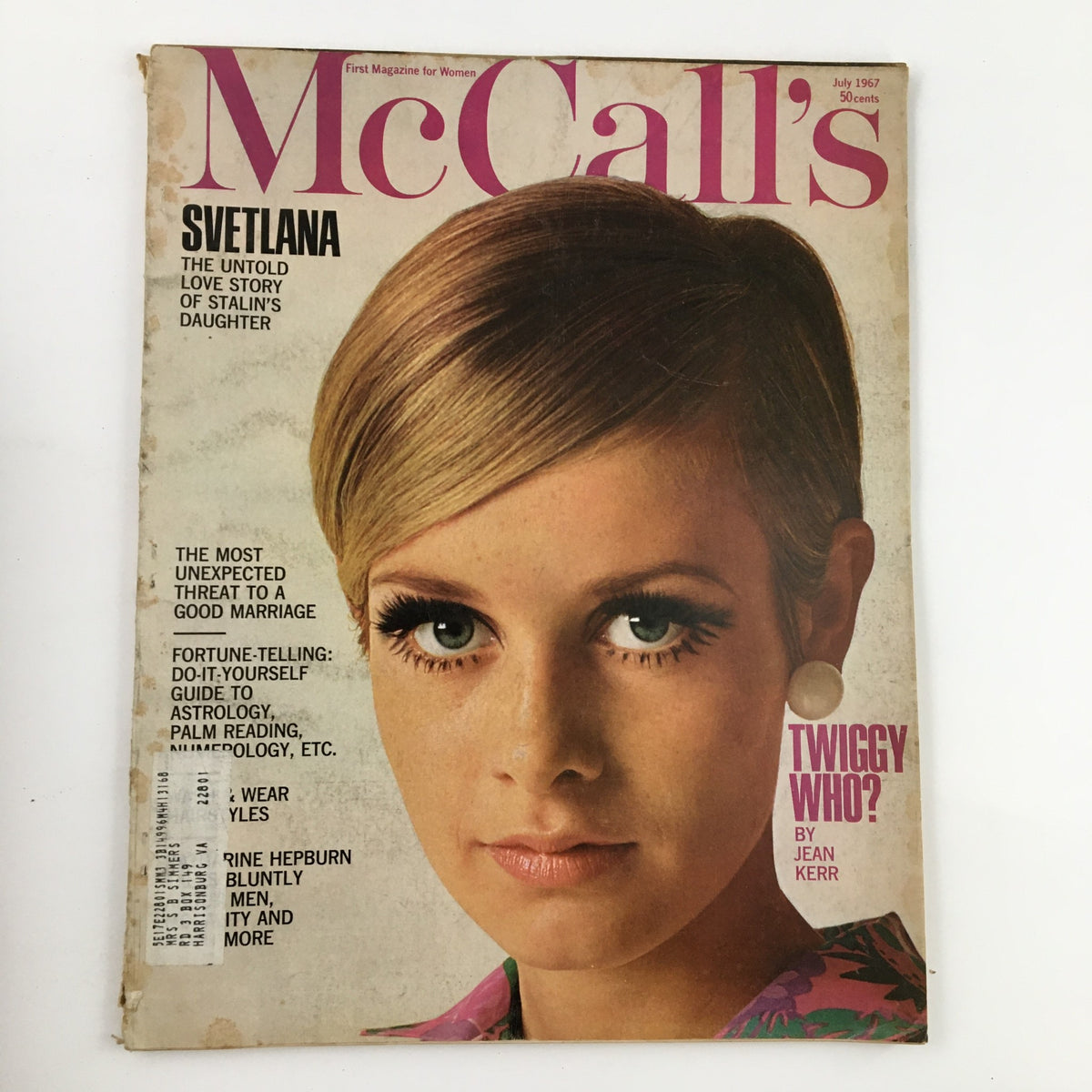 Cover of McCall's Magazine July 1967 featuring a close-up photograph of Twiggy by Otto Storch, showcasing her iconic 1960s beauty with bold eyelashes and a stylish outfit, highlighting the fashion trends of the era.
