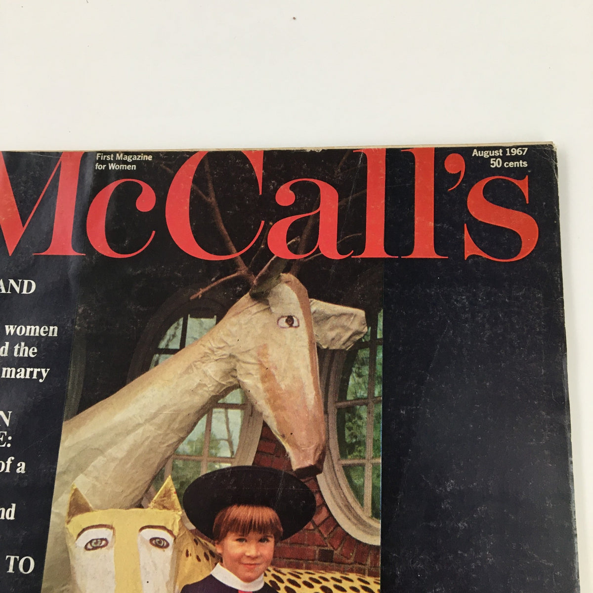 Another close-up view of the McCall's Magazine August 1967 cover highlighting the title 'Marilyn Monroe: Memories of a Poet, Was Her Friend' with a playful graphic design featuring a young girl and oversized animal masks.