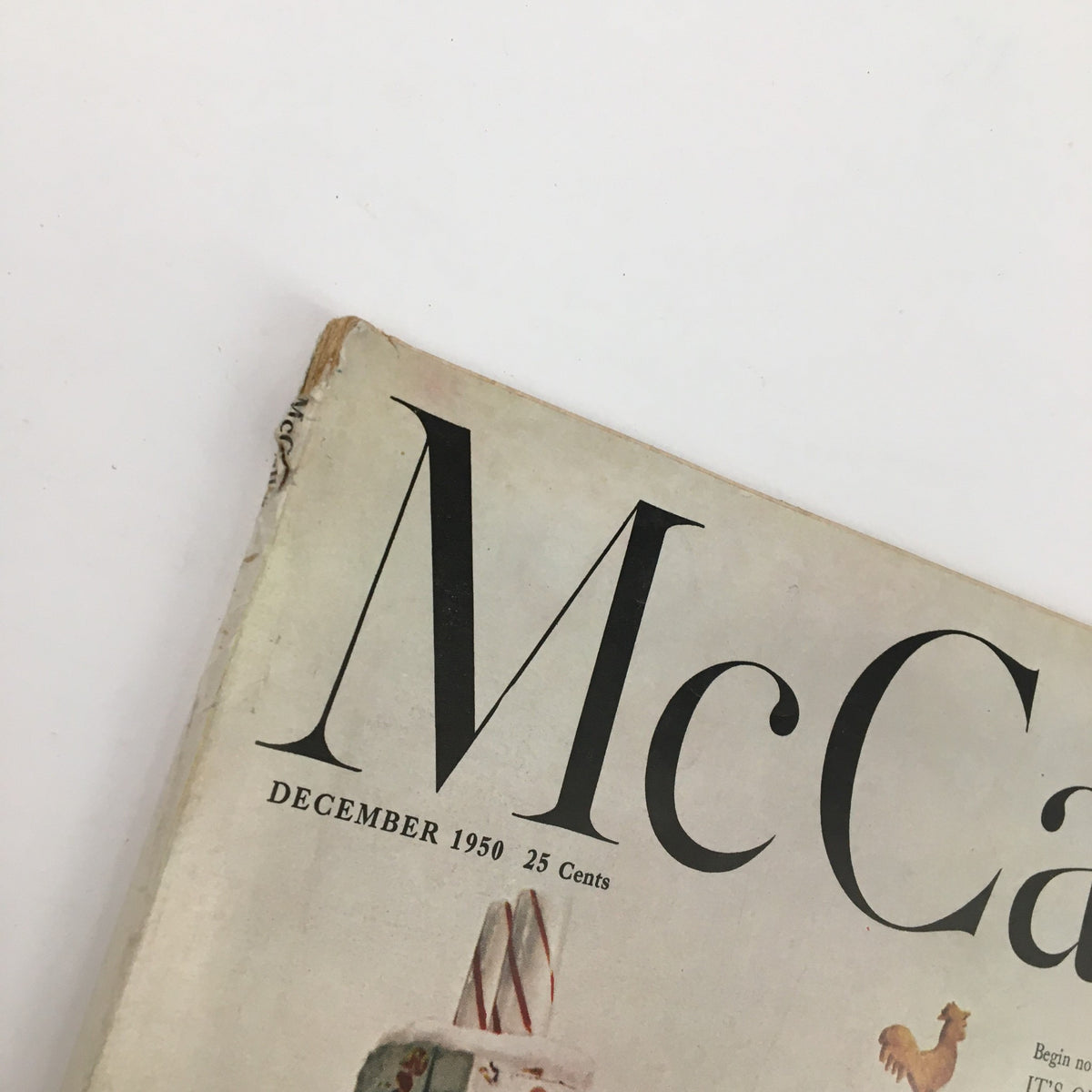 Close-up of the title section on the cover of McCall's Magazine December 1950, showcasing its vintage design and price.