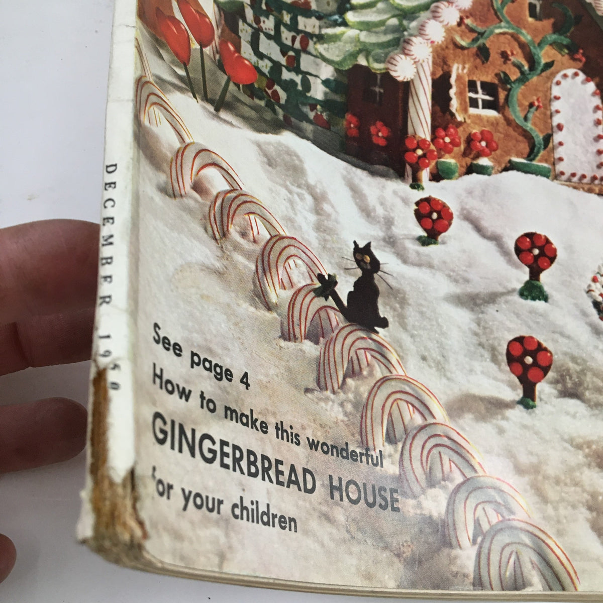 Side view of the cover of McCall's Magazine December 1950, emphasizing the title and details related to the gingerbread house article.