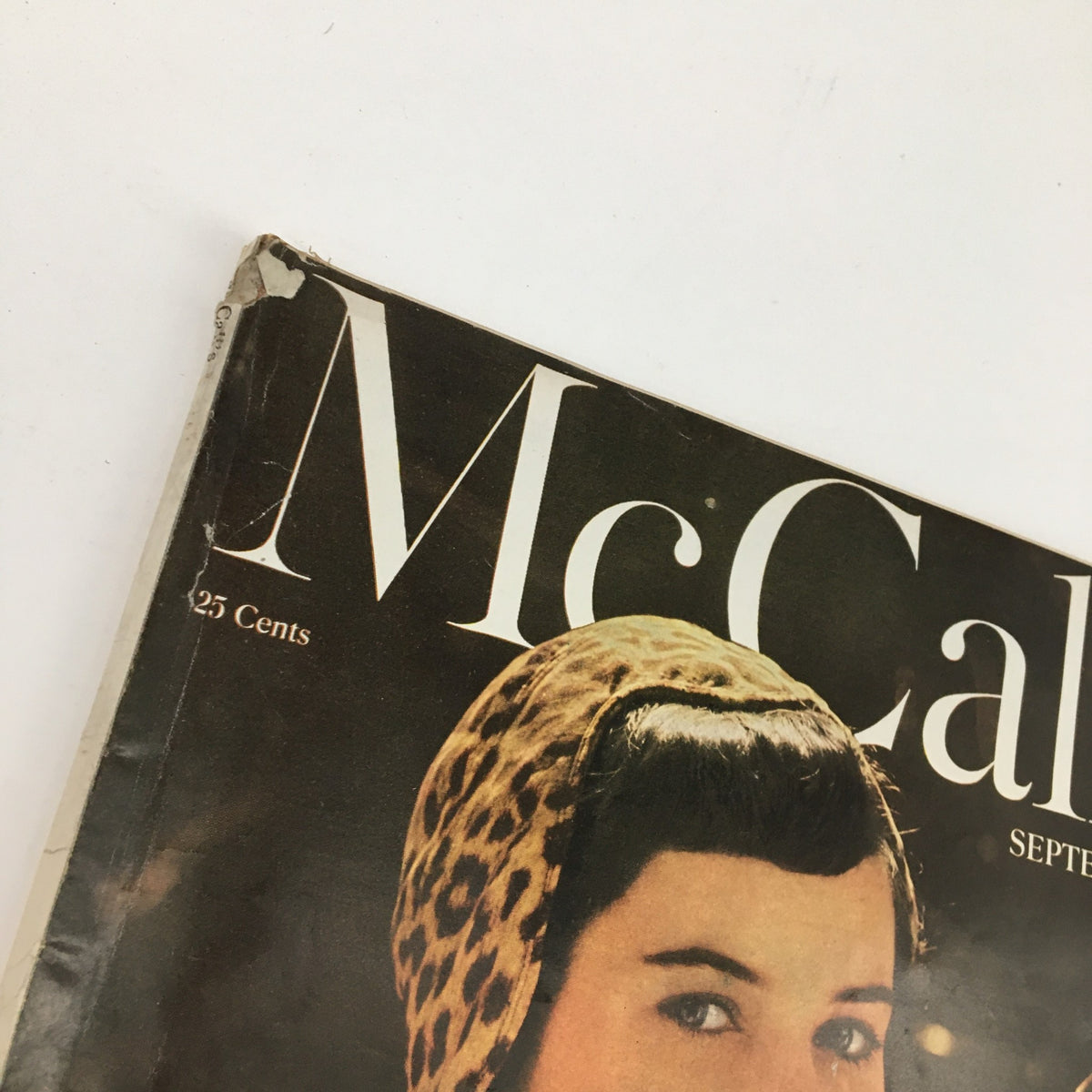 Cover of McCall's Magazine September 1950 featuring a woman with a leopard print headband and the magazine title prominently displayed.