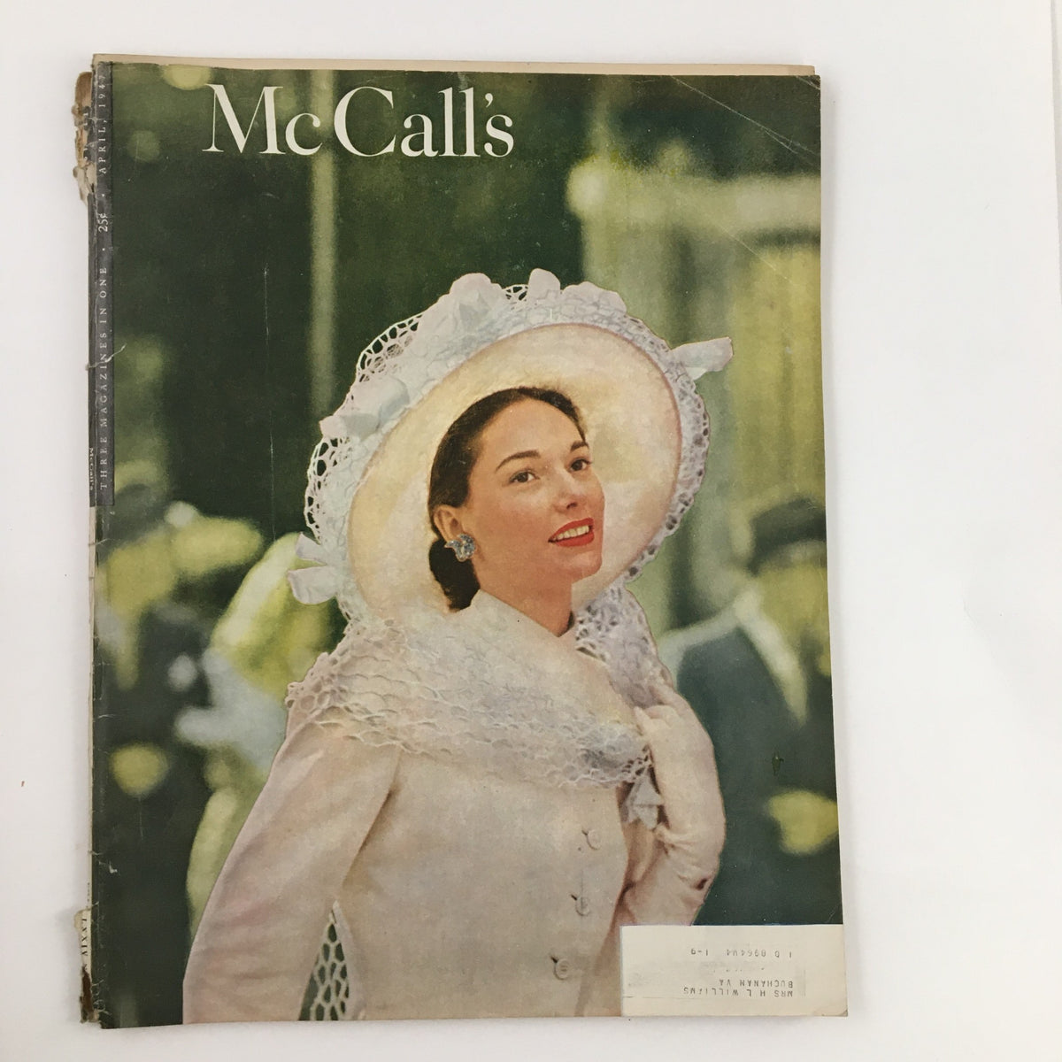 Cover of McCall's Magazine April 1947 featuring a model in a stunning Bauman Greene costume designed by Hattie Carnegie, showcasing vintage fashion from the mid-20th century.