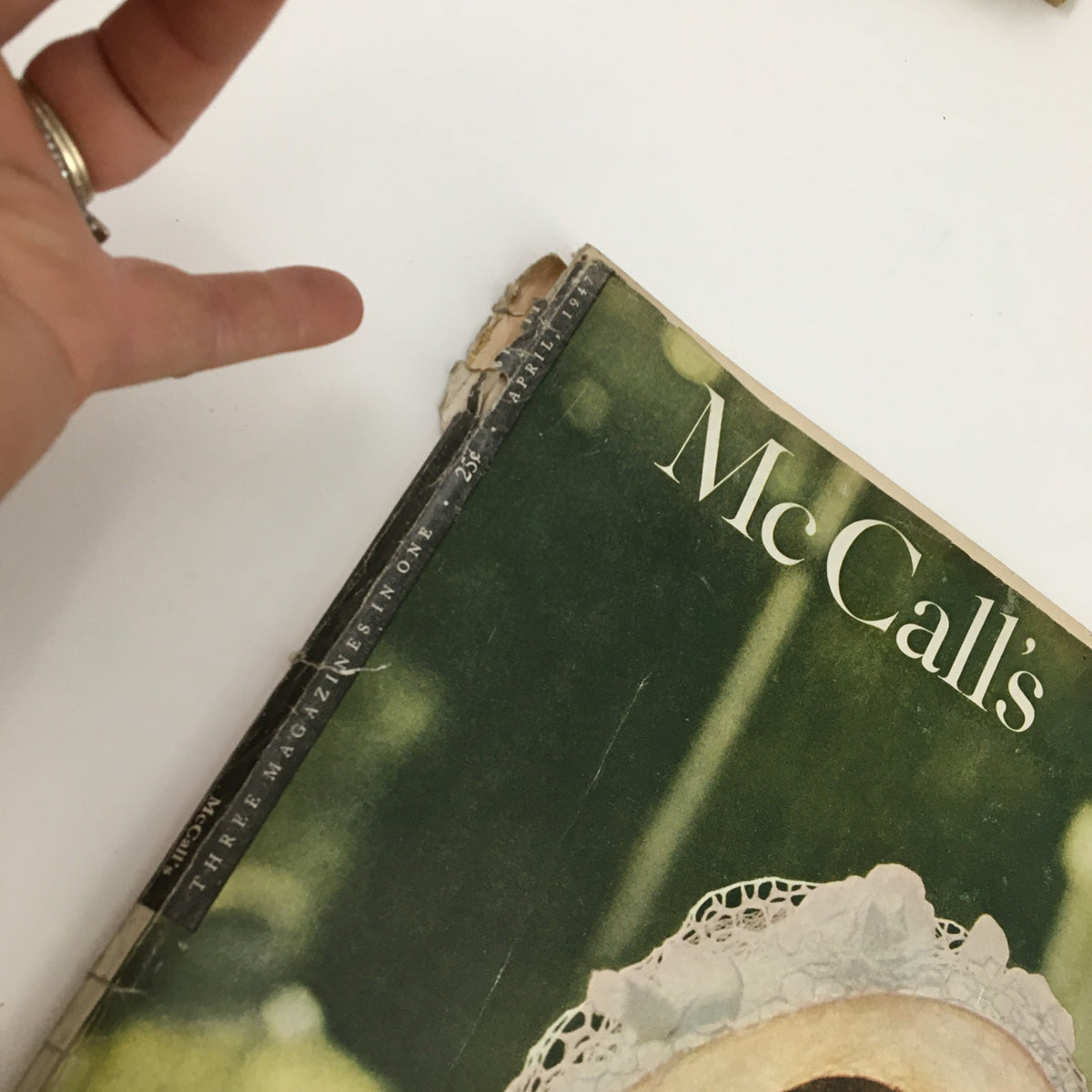 Close-up of the top edge of McCall's Magazine April 1947, highlighting the vintage wear and address label on the cover, reflecting its historical significance.