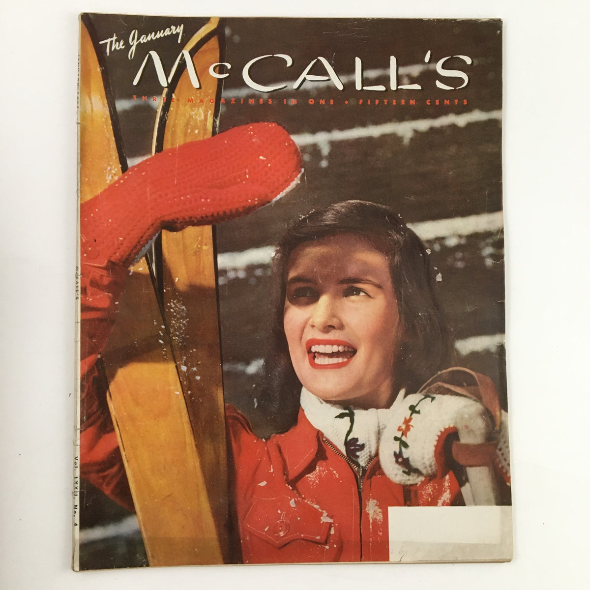 Cover of McCall's Magazine January 1945 featuring a woman in a red jacket and mittens, showcasing vintage fashion and sewing inspiration.