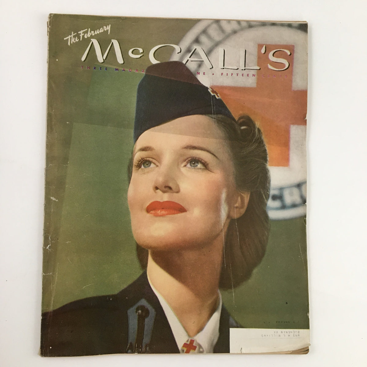 Cover of McCall's Magazine February 1945, featuring a woman with elegant makeup and hairstyle, dressed in a stylish outfit, symbolizing post-war fashion and personal style.