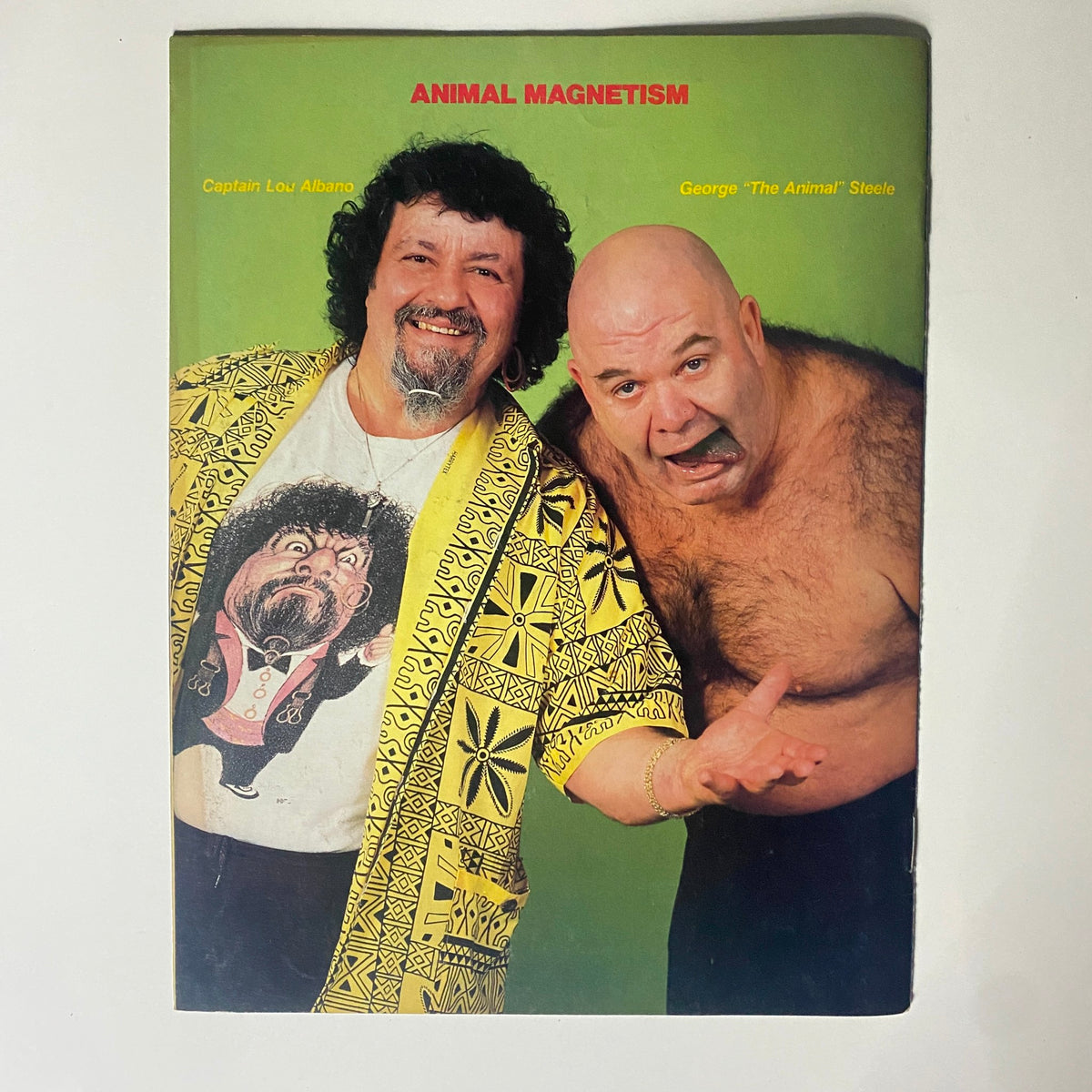 Cover of vintage WWF magazine titled 'Animal Magnetism' featuring Captain Lou Albano and George 'The Animal' Steele in vibrant colors.