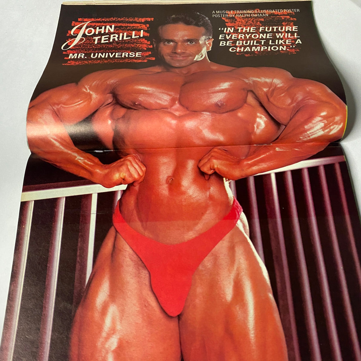 Centerfold poster from Muscle Training Illustrated, October 1988, featuring John Terill, Mr. Universe, emphasizing bodybuilding excellence.