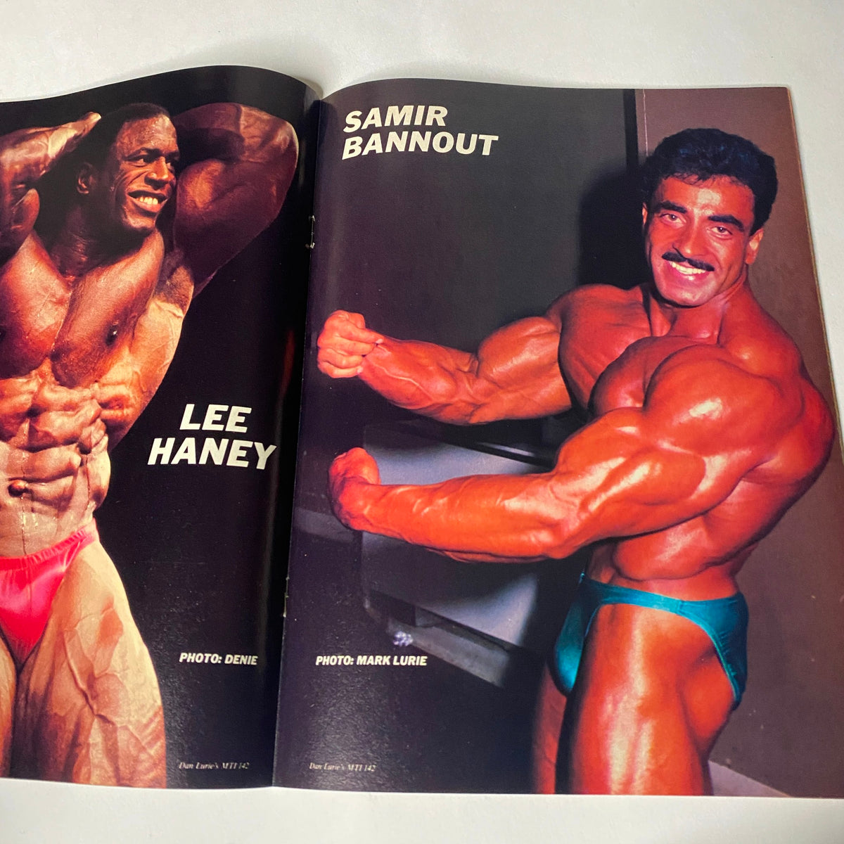 Inside spread of Muscle Training Illustrated May 1988 displaying Lee Haney and Samir Bannout. This edition highlights interviews and profiles of bodybuilding champions.