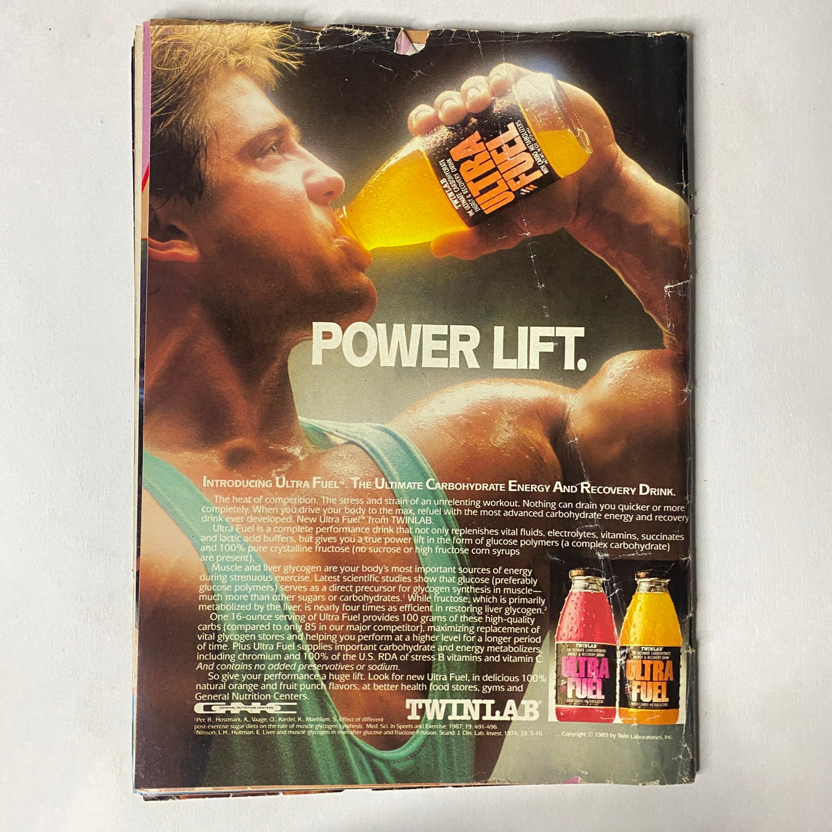 Back cover of Muscle Training Illustrated December 1989 No. 155 presenting an advertisement for Ultra Fuel energy drink, emphasizing muscle recovery and featuring product bottles, appealing to fitness enthusiasts.