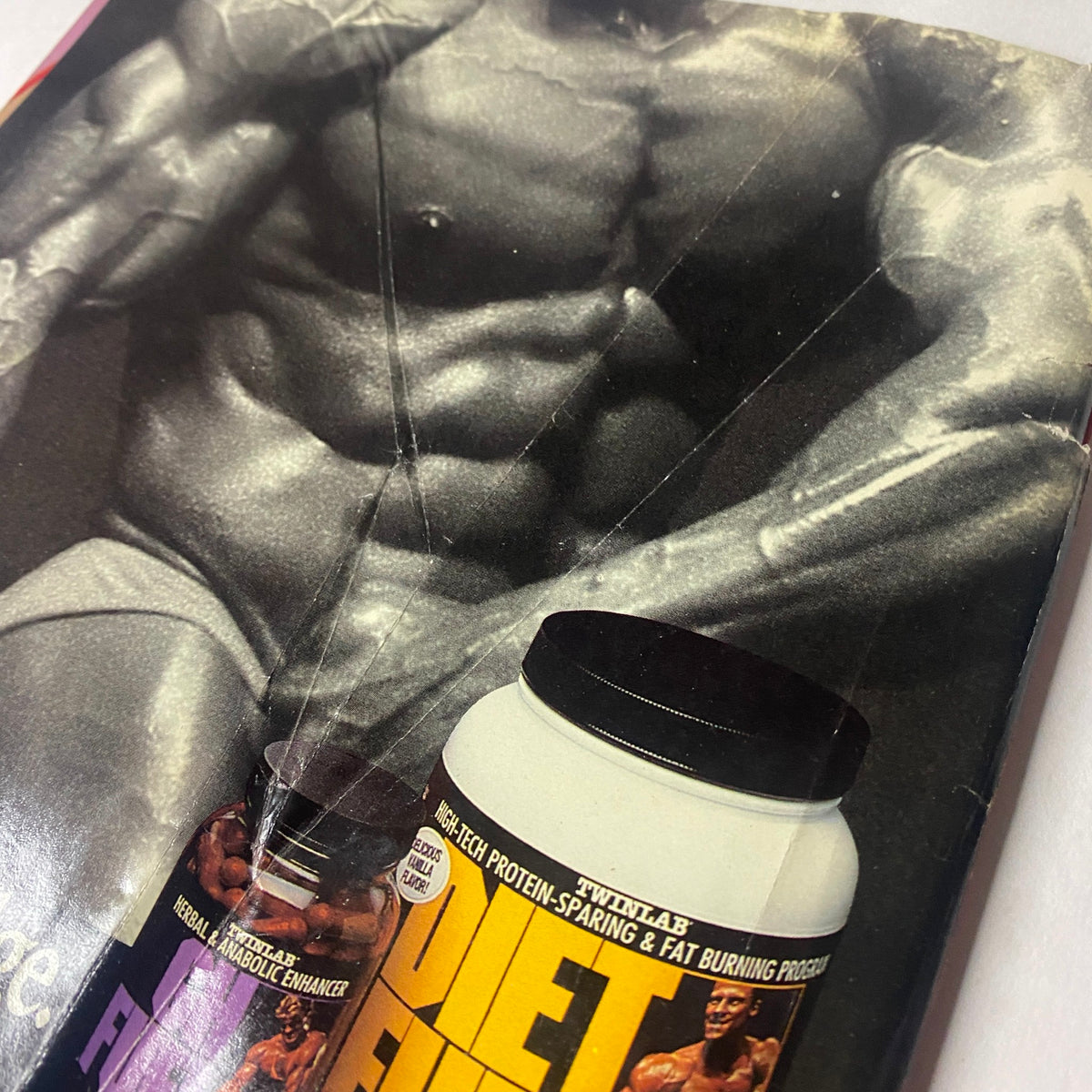 Close-up detail of an advertisement from the back of Muscle Training Illustrated April 1989 focusing on bodybuilding supplements and nutritional products.