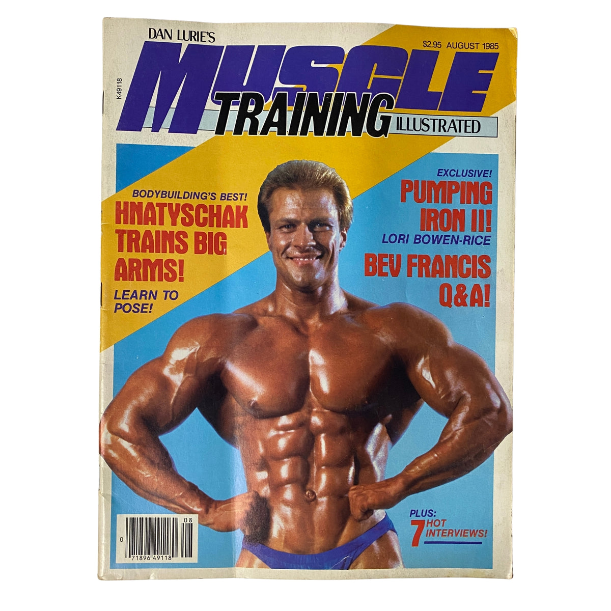Cover of Muscle Training Illustrated August 1985 No. 124 featuring John Hnatyschak showcasing his muscular physique, highlighting the features of the Special People Issue.
