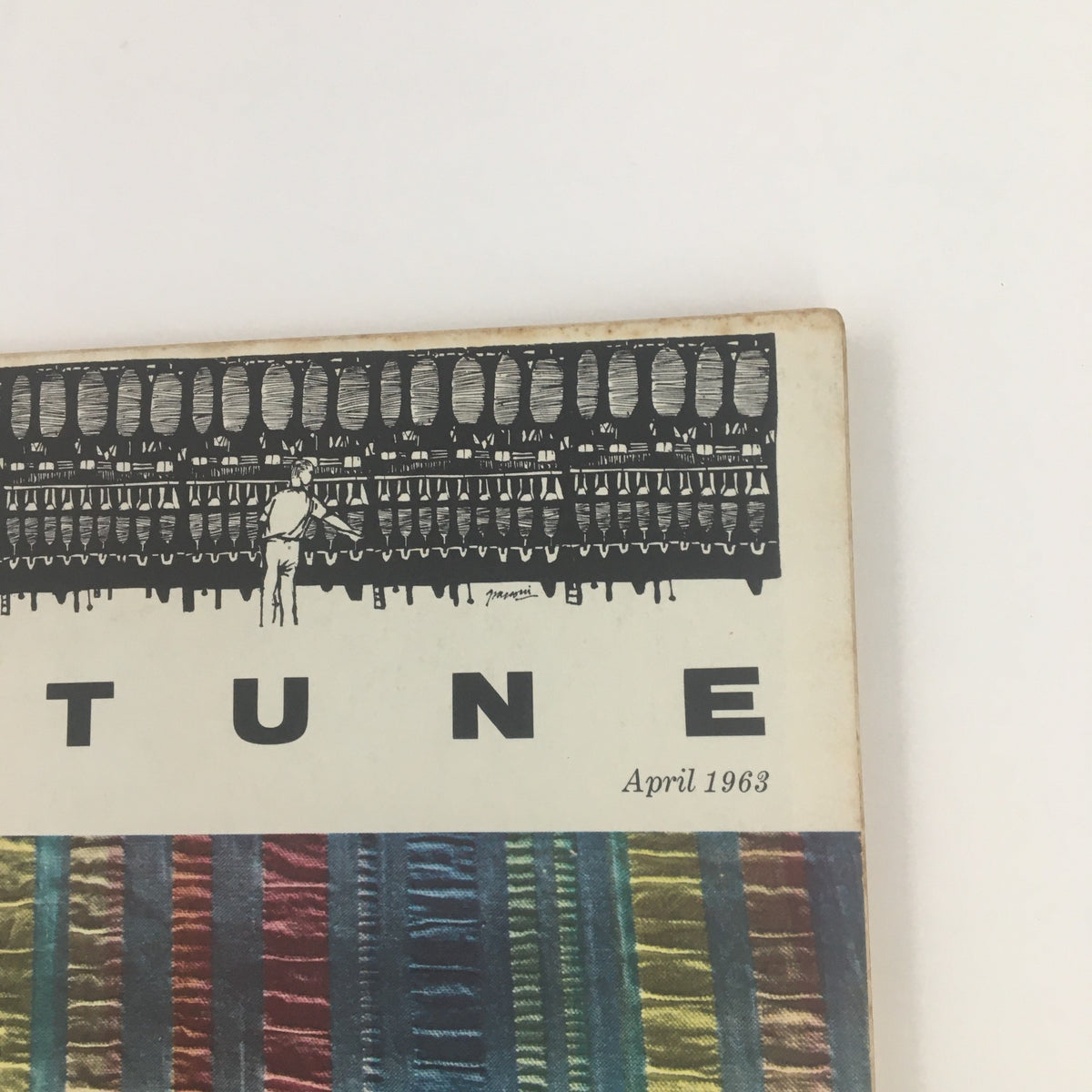 Close-up of the Fortune Magazine April 1963 cover showing detailed textile designs and a reference to corporate industries.