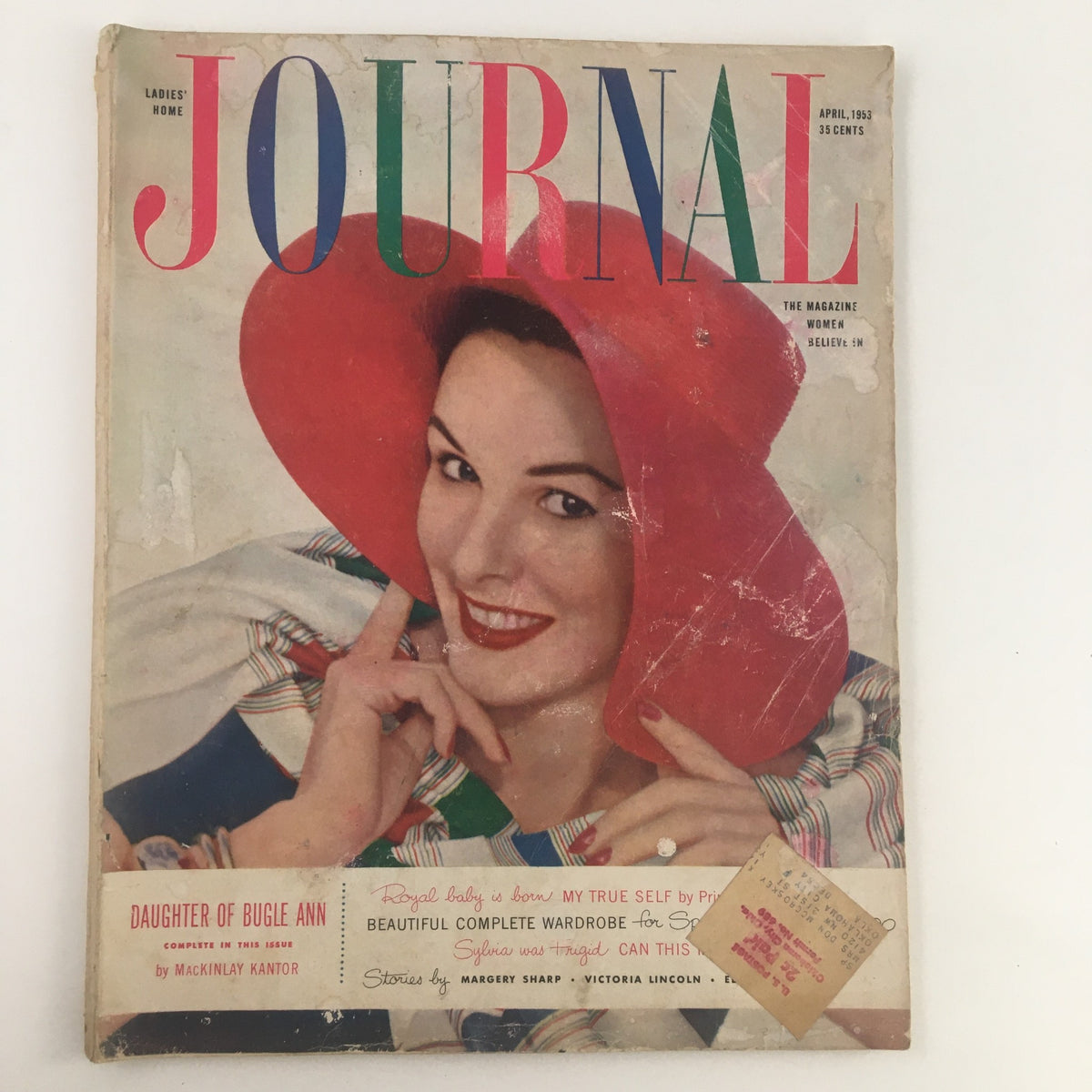 Cover of Ladies' Home Journal Magazine April 1953 featuring vibrant colors and a smiling woman in a red hat, titled 'Daughter of Bugle Ann'.