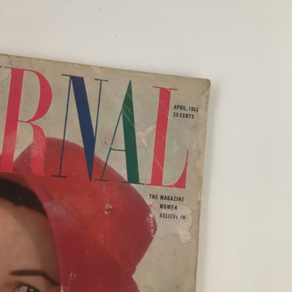 Close-up view of the top section of the Ladies' Home Journal Magazine April 1953 cover, showcasing the title and date.