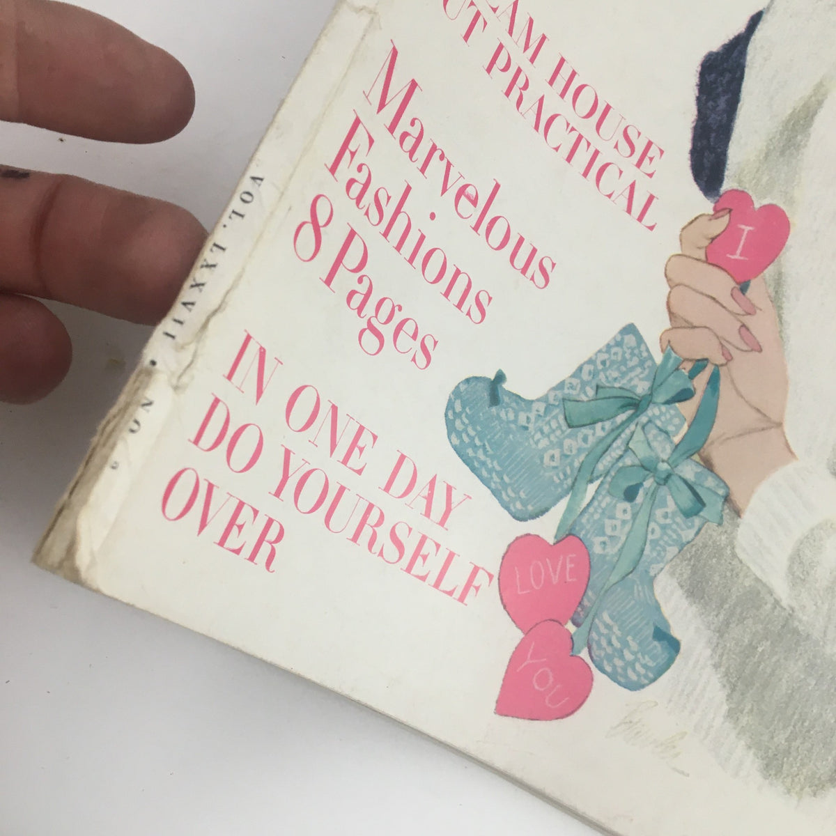 Close-up of the cover text from the February 1960 Ladies' Home Journal Magazine titled 'If I Had To Do It Over Again', highlighting articles about fashions and practical home tips with colorful hearts and decorations.