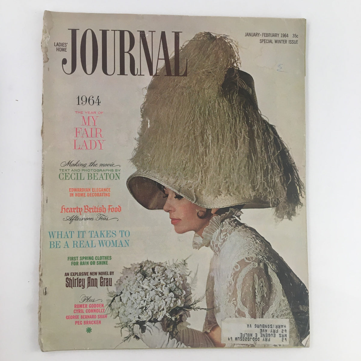 Cover of Ladies' Home Journal Magazine January 1964 featuring the theme 'What It Takes To Be A Real Woman', showcasing a woman in a vintage hat, symbolizing the fashion of the 1960s.