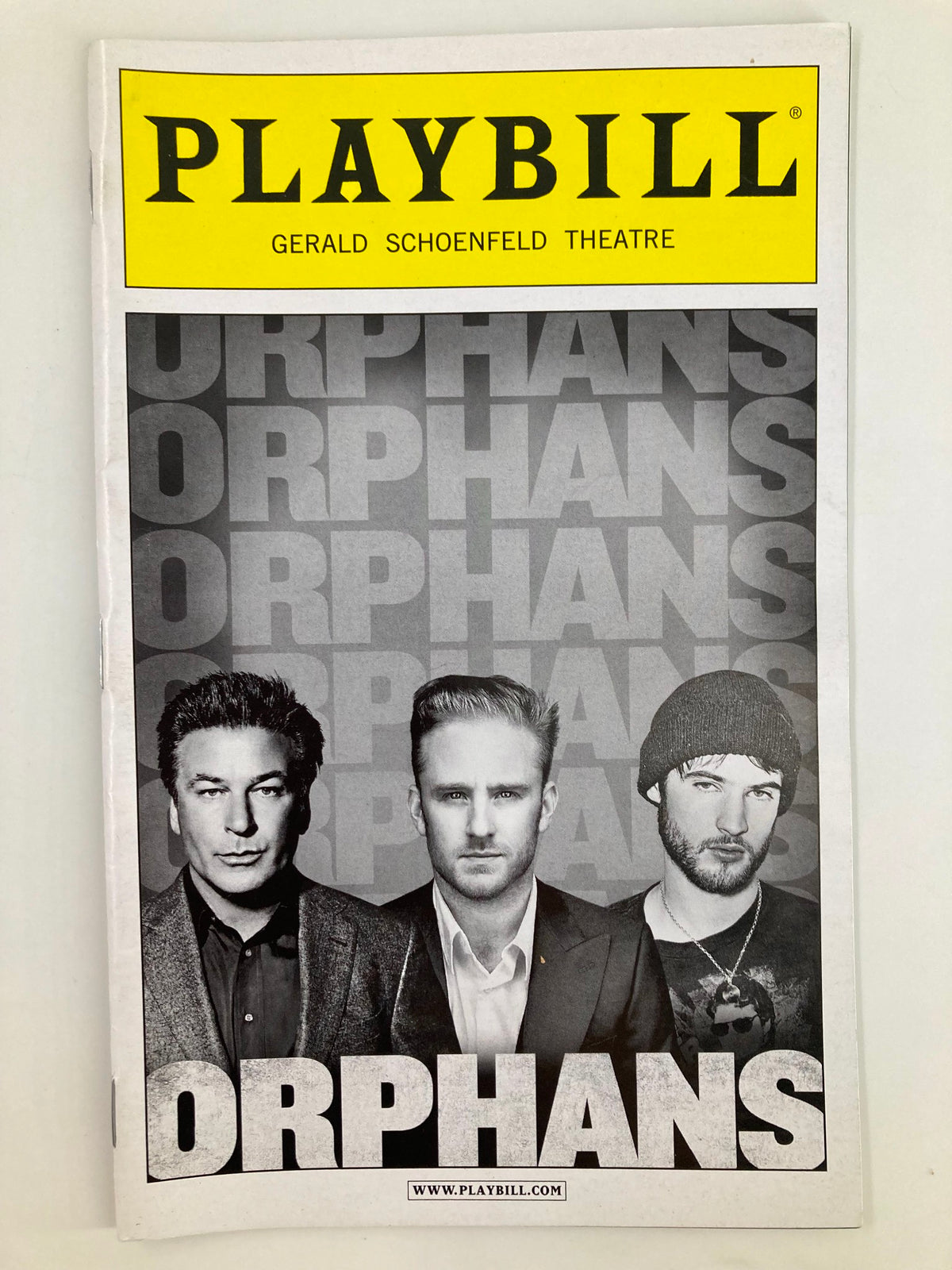 2013 Playbill for the play Orphans at Gerald Schoenfeld Theatre featuring actors Alec Baldwin, Ben Foster, and a dramatic composition.